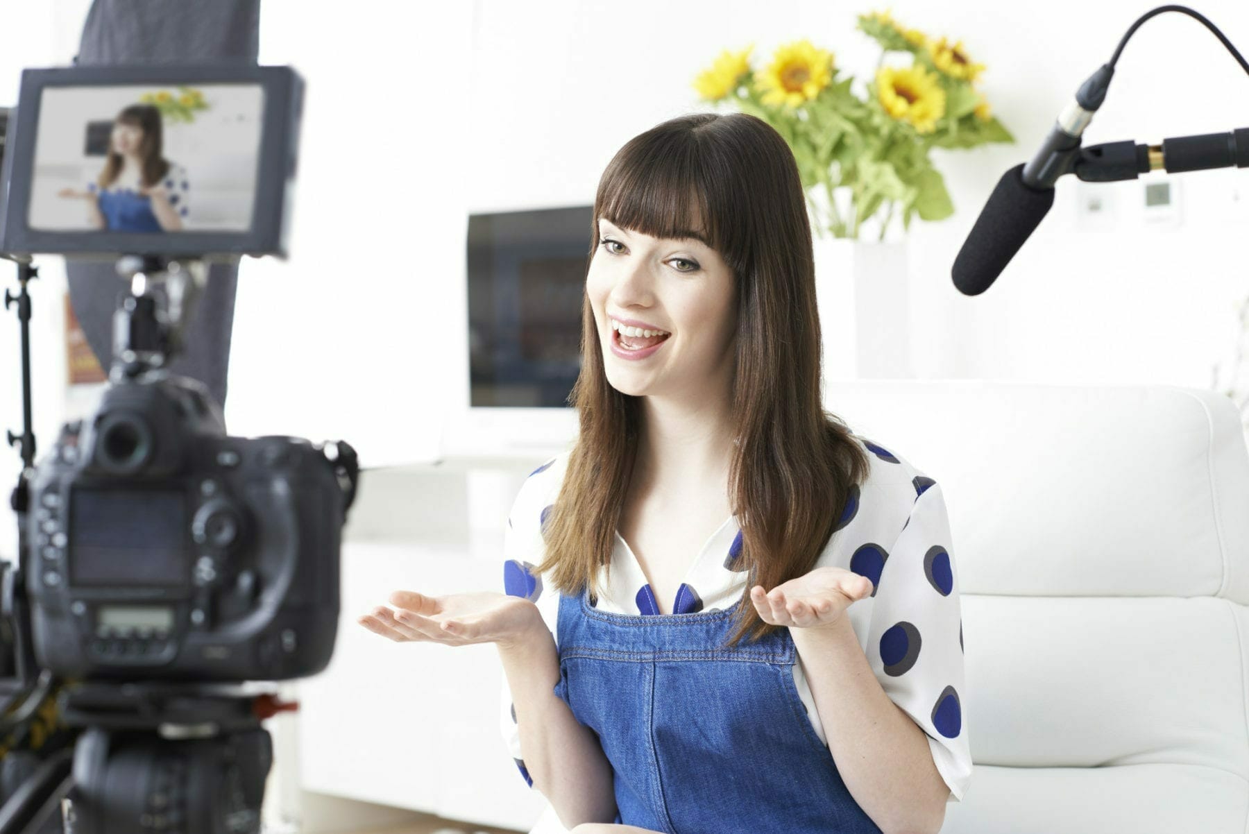 Female Vlogger Recording Broadcast At Home